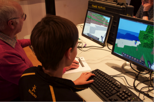 Never to old to play Minecraft! John (70) getting taught how to play Minecraft Pi by Isaac (10)