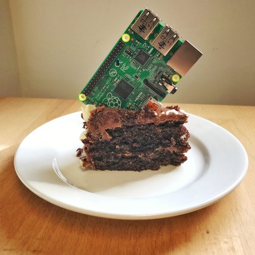 A Raspberry Pi stuck into a piece of birthday cake