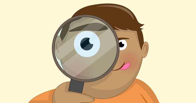 child looking through a magnifying glass