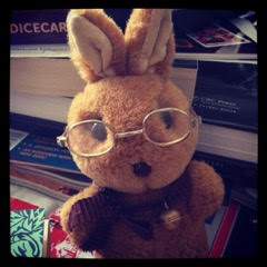 stuffed toy rabbit wearing glasses