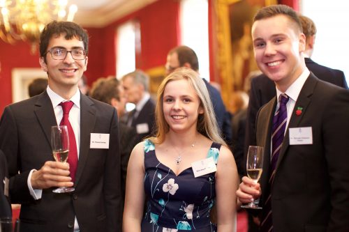 Matthew Timmons-Brown and two other young people at a reception in the Houses of Parliament