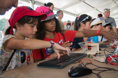 Girls use the physical computing blocks at Maker Faire New York