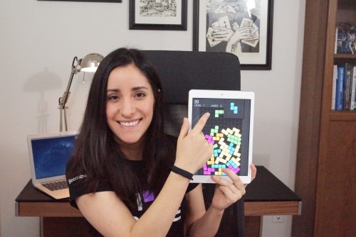A woman showing off a game on a tablet — Estefannie Explains it All Raspberry Pi