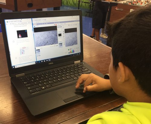 A boy at a laptop coding in Scratch — Boys & Girls Club