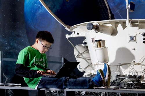 A young person coding during a Moonhack event.