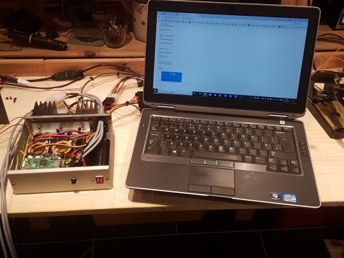The final build next to a laptop displaying the beer cooler web interface for maintenance on the go