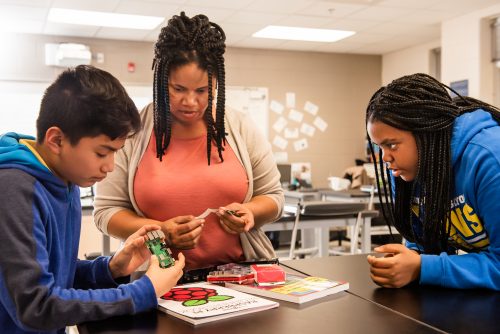 An educator teaches students to create with technology.