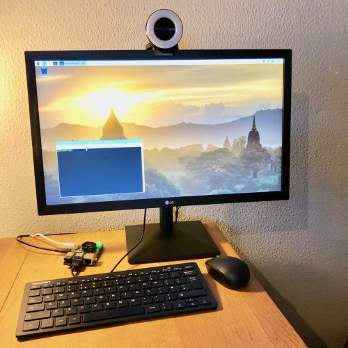 My Raspberry Pi 4 which I use for video calls perched on the edge of my desk at home