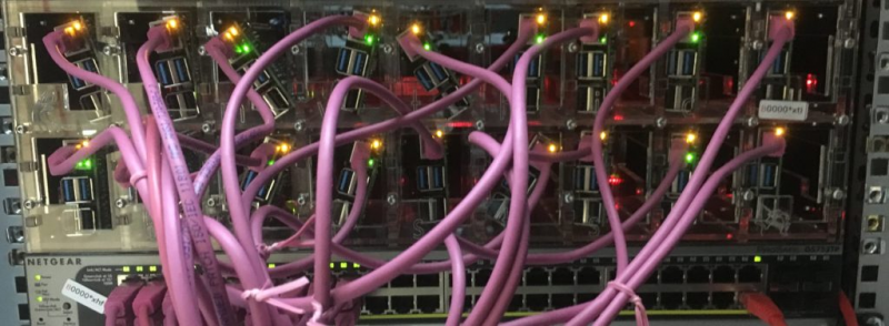 A rack of Raspberry Pis and a mess of wires connecting them