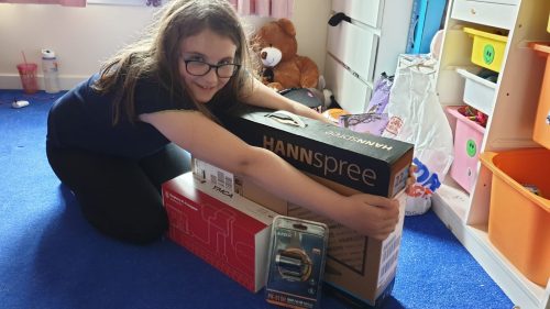 A young person receives a Raspberry Pi kit to learn at home