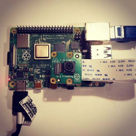 Birds eye view of Raspberry Pi 4 with a camera module connected