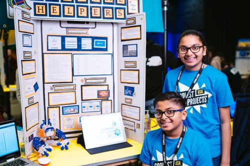 Two siblings presenting their digital making project at a Coolest Projects showcase