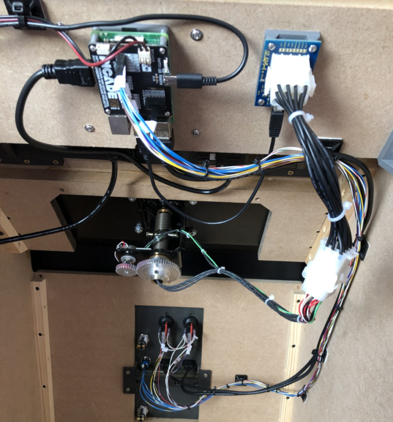 The workings were simple when it came down to it: Raspberry Pi 3B+ with Pimoroni Picade X HAT. This gives us a power switch, audio amp, buttons, and a joystick if necessary. The replica yoke is interfaced with a USB adapter from the same company