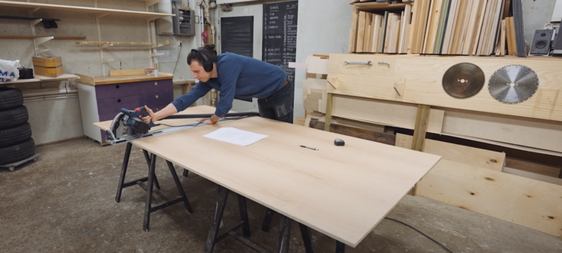 Maker cutting large piece of wood for the project