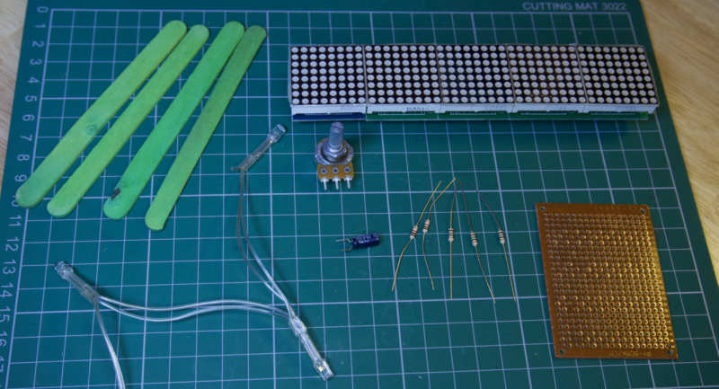 Additional components for the build include resistors, a capacitor, and perfboard