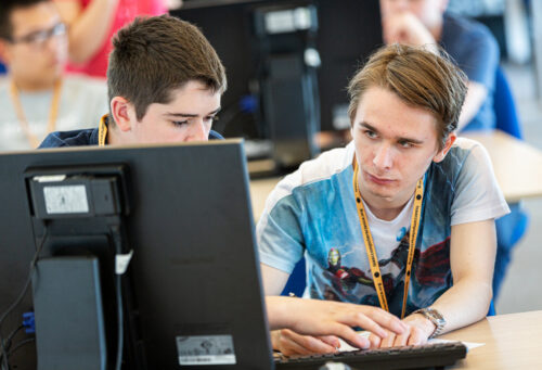 Two learners at a computer.