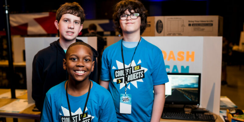 Three young tech creators show off their tech project at Coolest Projects.