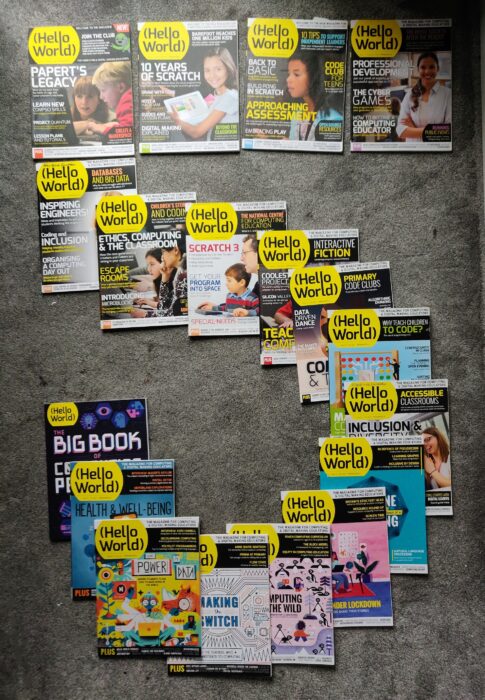Issues of Hello World magazine arranged to form a number five.