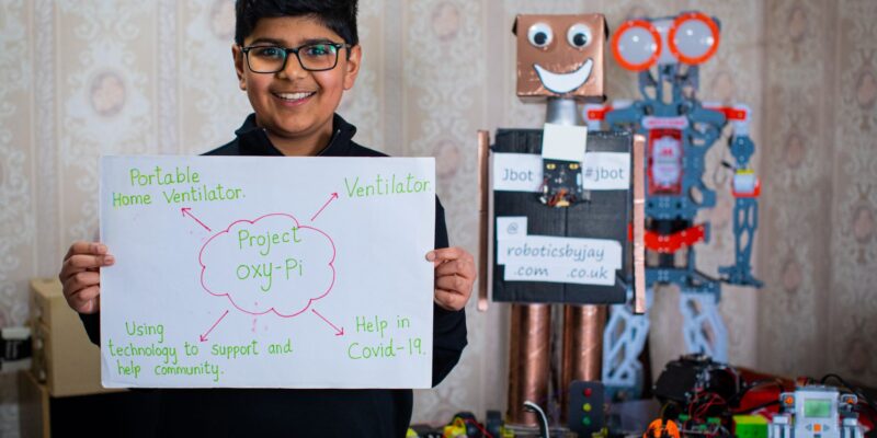 Young coder Jay shows off some of his robotics projects.