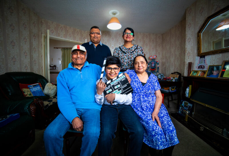 Young coder Jay at home with his family.