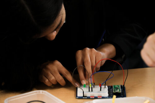 A student uses a Raspberry Pi Pico in the computing classroom.