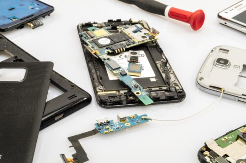 A smartphone with the back cover taken off so it can be repaired.