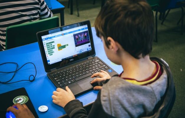 Young person using Scratch.