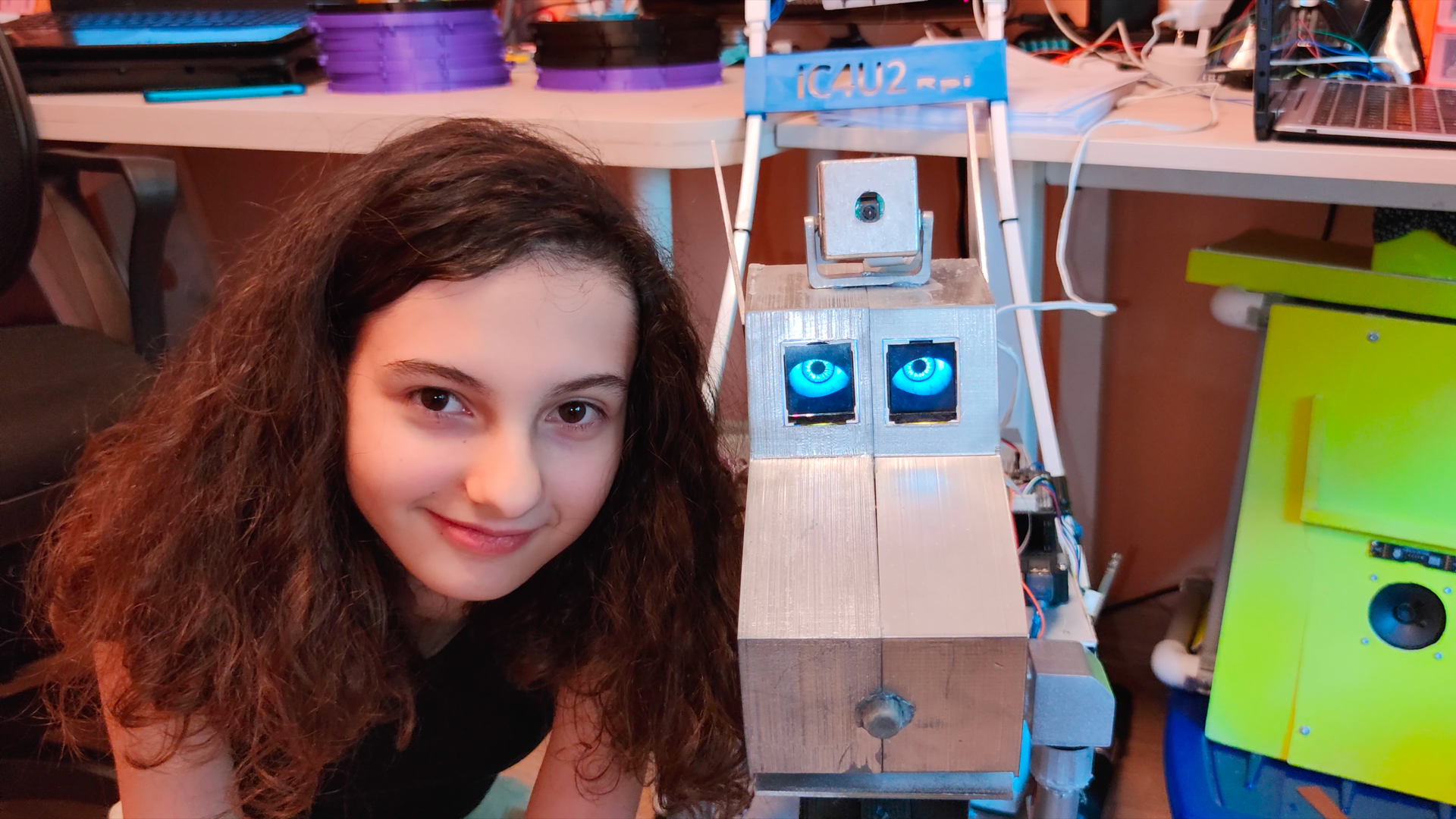 Selin and a robot she has built.