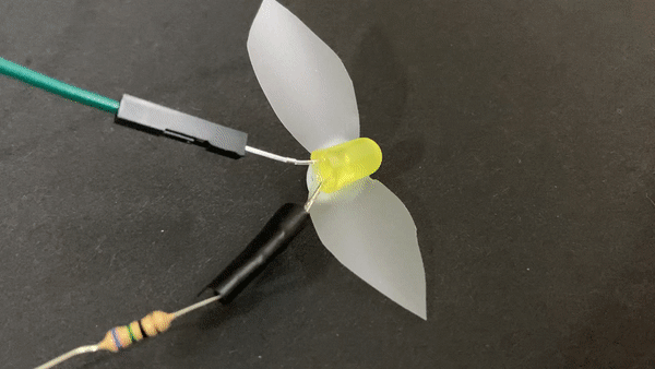 A blinking LED with paper wings. 