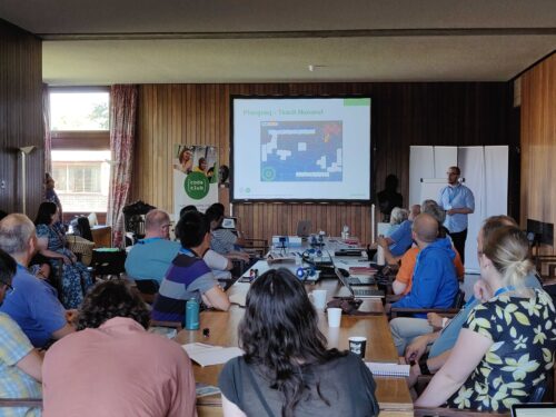People in a workshop listen to a presentation.