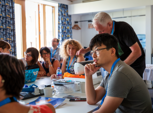 Workshop attendees at a table.