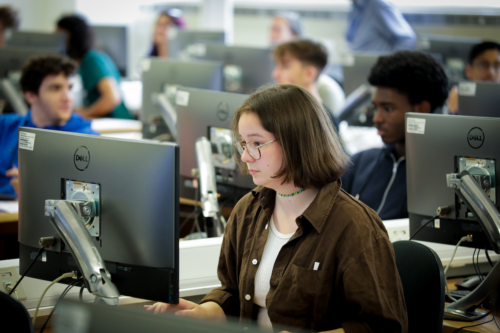 A teenager learning computer science.