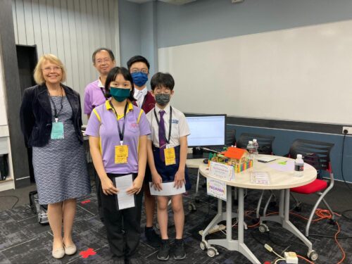 Sue Sentance with a group of participants showcasing their project at the STEM Trailblazers event.