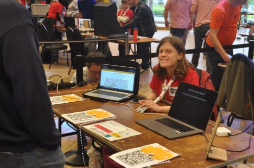 A young tech creator with a laptop at Coolest Projects Belgium.