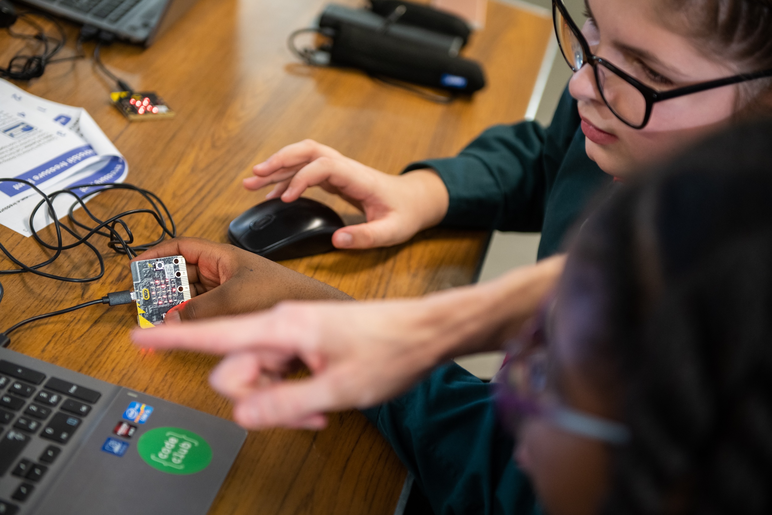 Young learners coding a microbit project.
