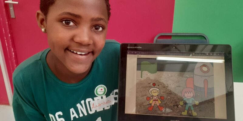 A young tech creator with her Scratch project at Coolest Projects South Africa 2023.
