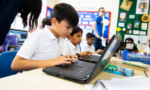 Young people in a coding lesson.