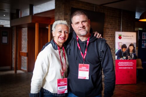 Two people smiling at the camera.