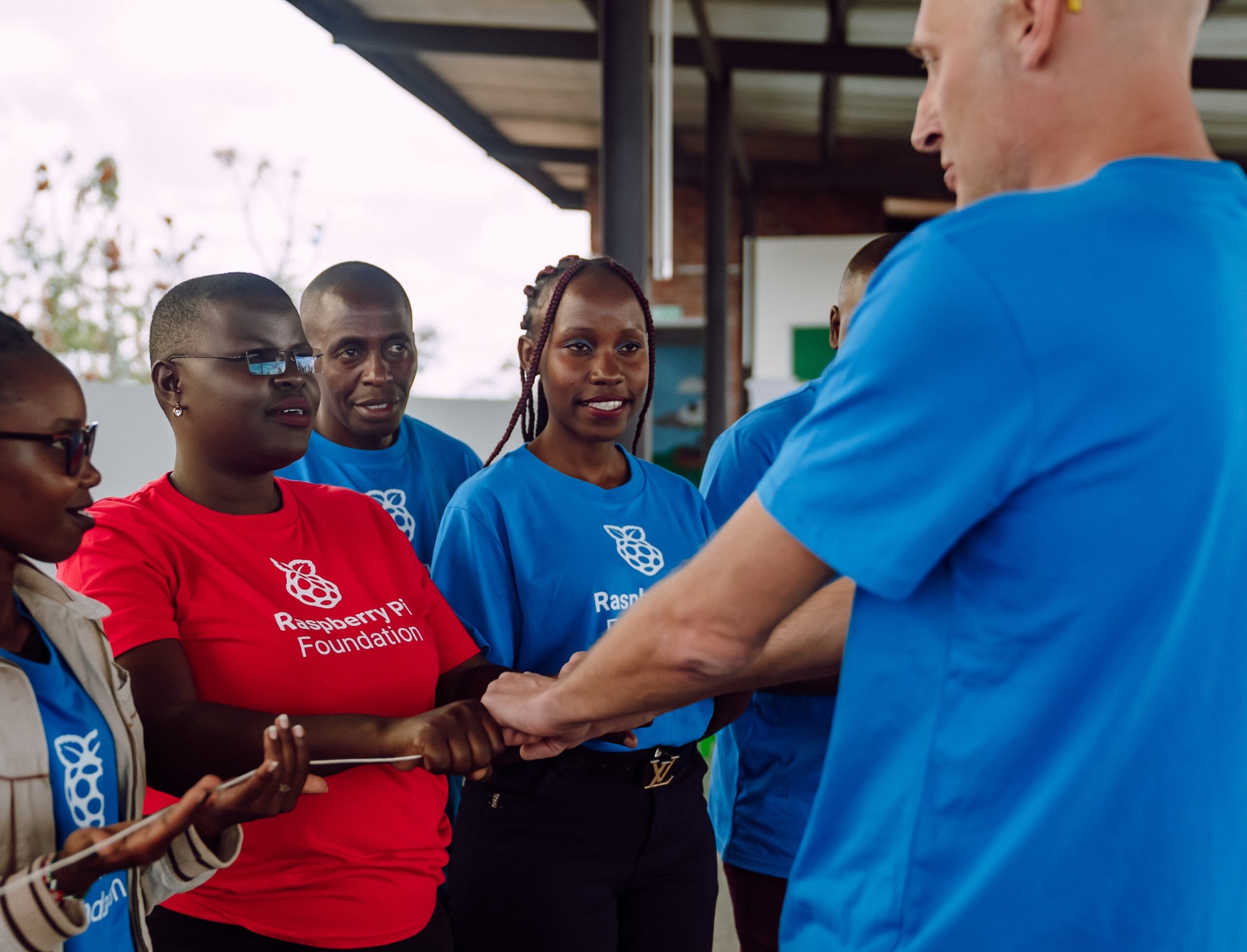 Educators do a computer networking activity with a piece of string.