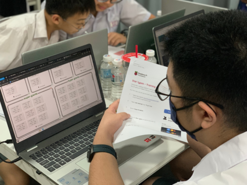 A student uses a laptop in a classroom.