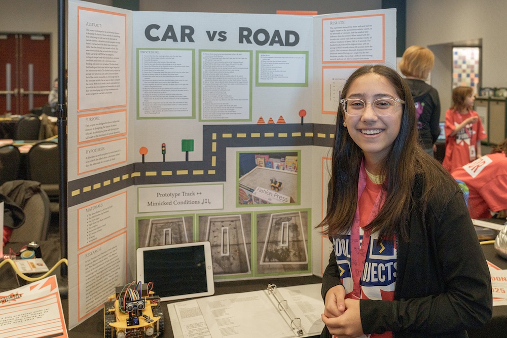 Kaila presenting her project at Coolest Projects USA.
