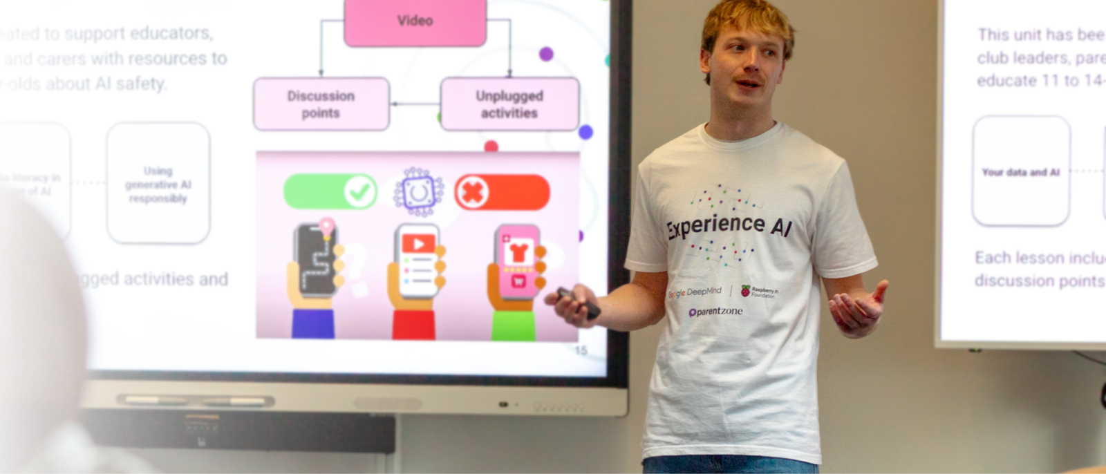 An educator is delivering a presentation during a workshop.