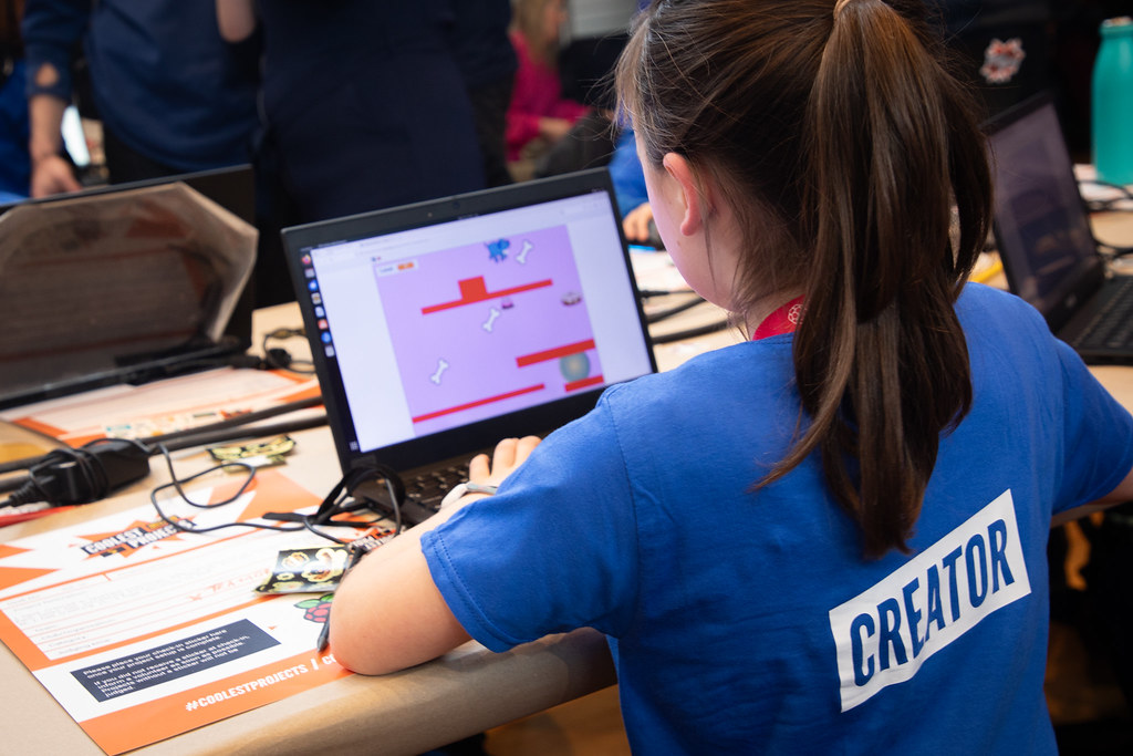 A young creator playing a game made in Scatch