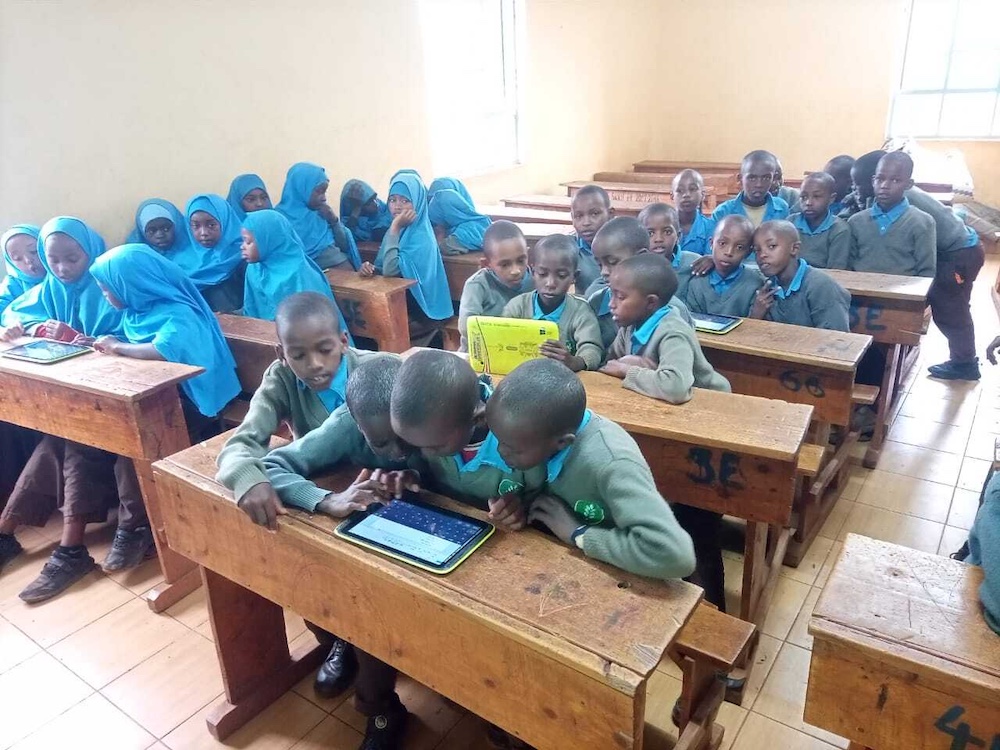 Young people learning about computing in a classroom.