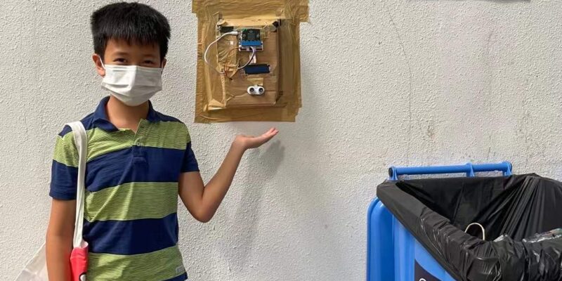 Matthew with his device developed in Year 6 to promote recycling behaviour in his residential community