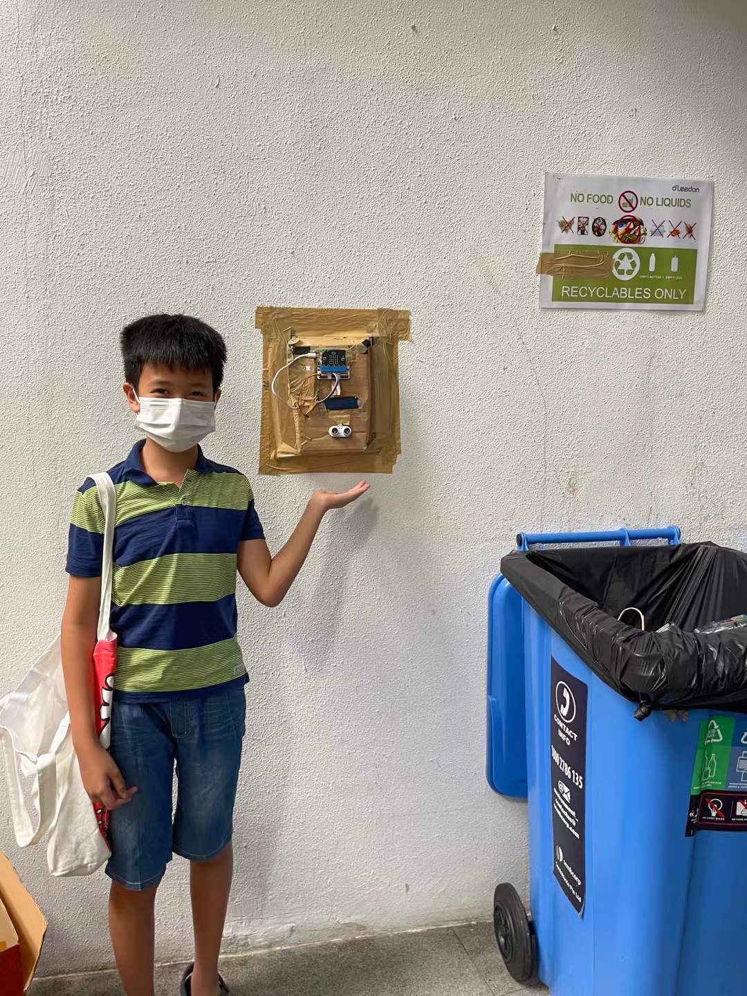 Matthew with his device developed in Year 6 to promote recycling behaviour in his residential community