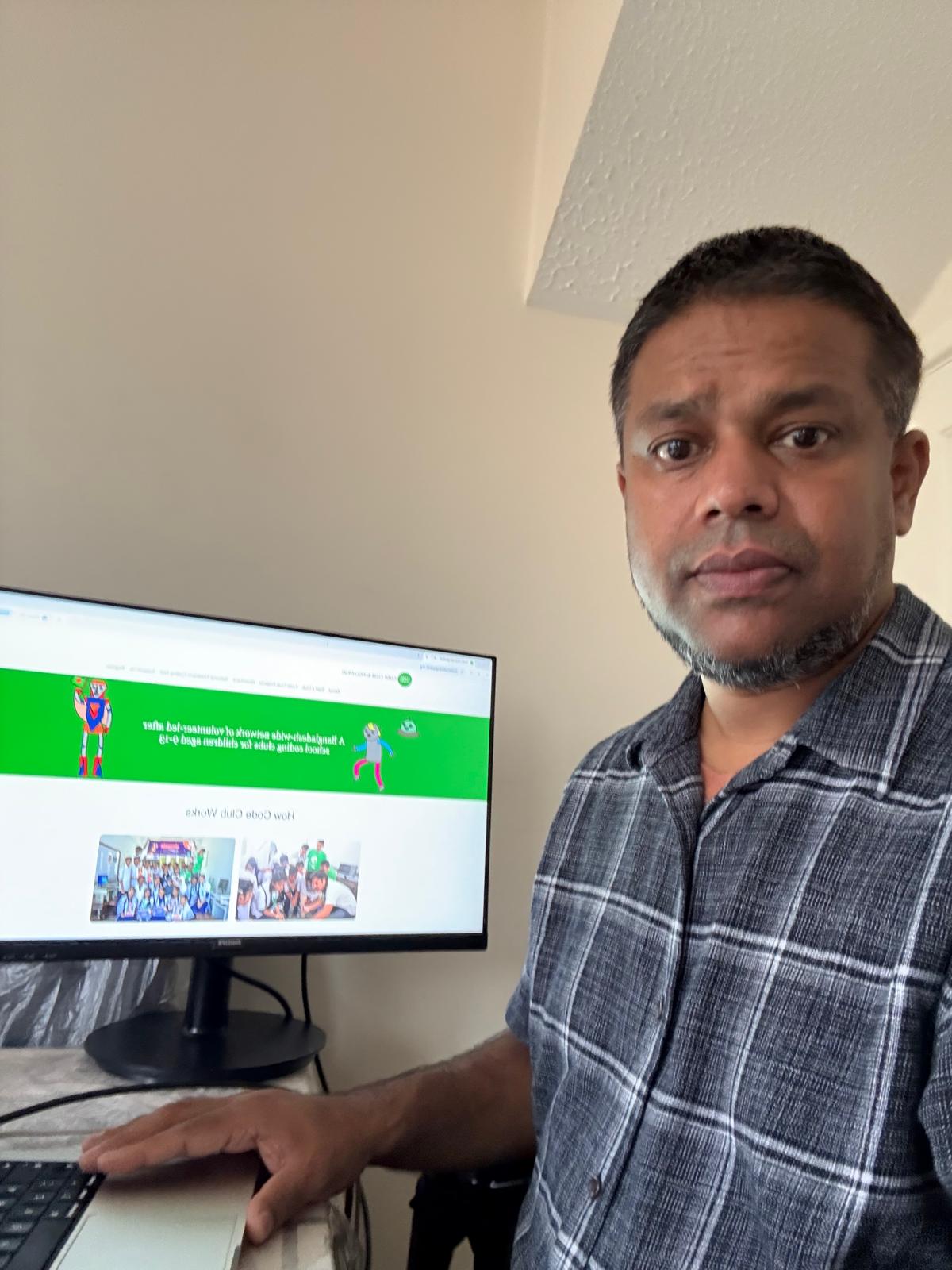 Shajan at a computer.
