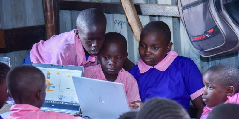Young people use laptops to do their coding tasks.