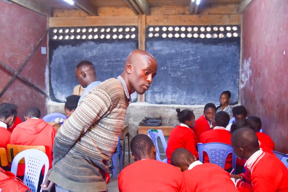 A mentor running a Code Club.