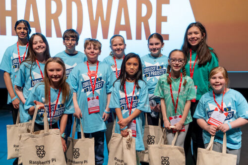 A group of children standing together at Coolest Projects event.